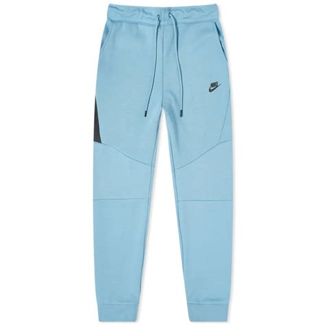 baby blauw nike tech|dark blue nike tech pants.